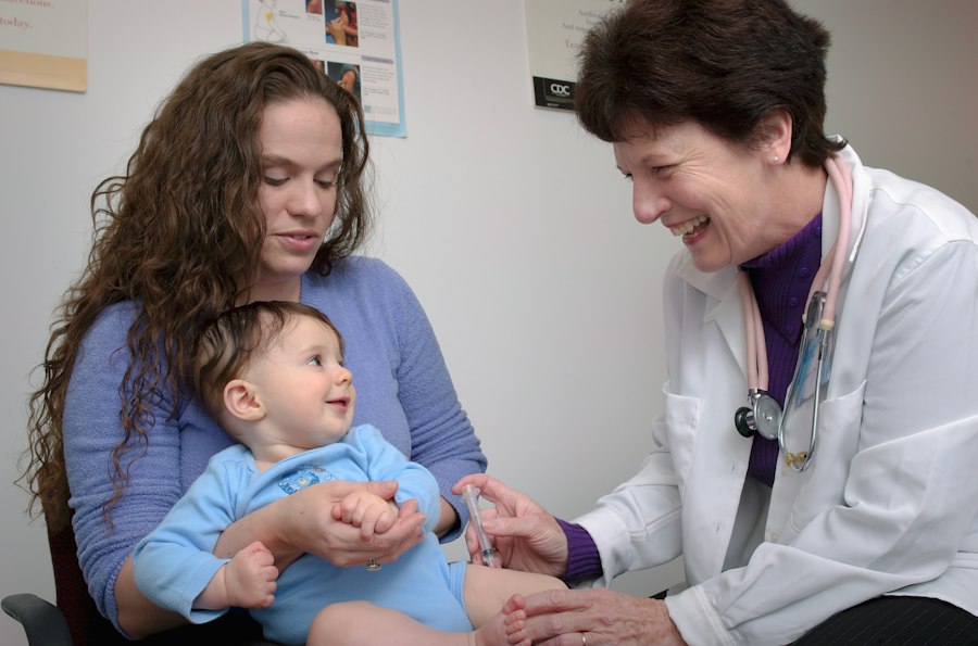 Doctor examining a young child